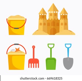 Beach sand castle with children's bucket, sand bucket, shovel, r