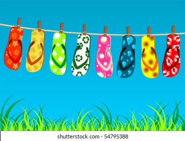 Beach sandals. Different colorful flip-flops hanged on a rope.