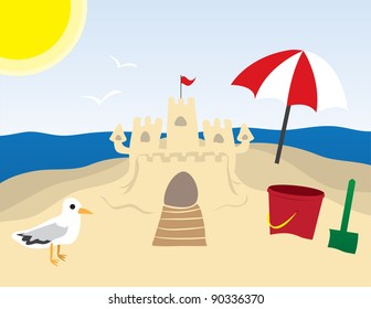 Beach scene with sandcastle and ocean in the background.