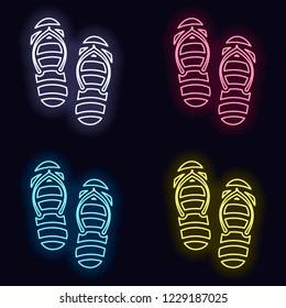 Beach slippers. Flip flops icon. Set of neon sign. Casino style on dark background. 