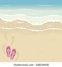 Beach in Summer time. Footprint and flip flops