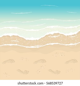 Beach in Summer time. Footprints in the sand