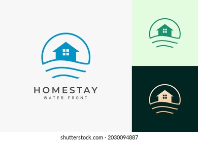 Beach theme resort or hotel logo with ocean wave and circle