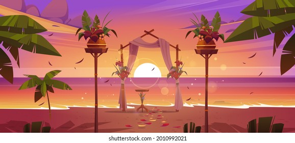 Beach wedding ceremony with floral arch at sunset