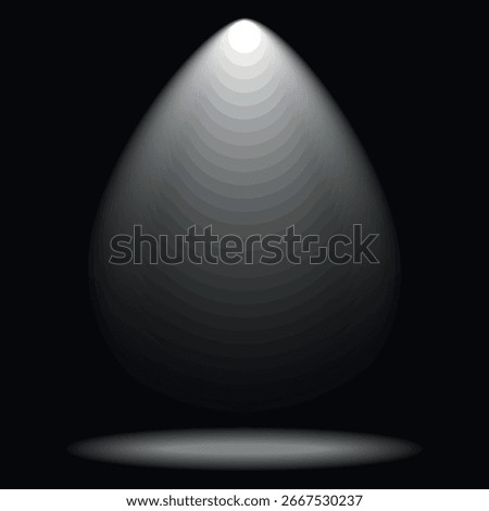 A beam of light falling from above onto a dark background, creating a spotlight effect. A faint reflection of light can be seen on the surface at the bottom.