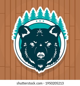 bear badge on wooden background