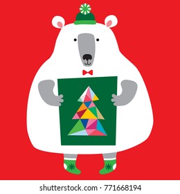 A bear in a cap holds a drawing of a Christmas tree in its paws. Christmas card. Merry Christmas and a Happy New Year!