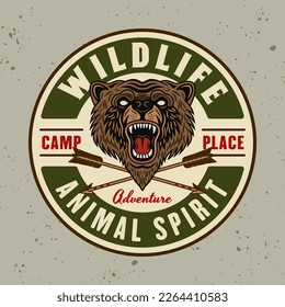 Bear colored round emblem, badge, label or logo with headline wildlife in vintage style vector illustration