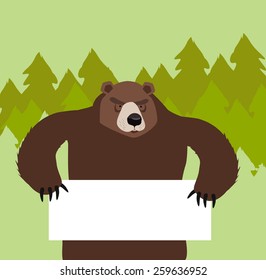  bear holding a sign In  forest