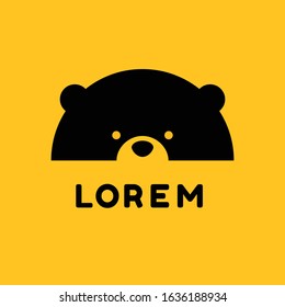 Bear logo design with half of bear face on yellow background