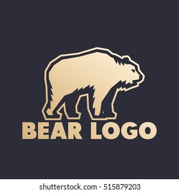 Bear logo element, gold on dark
