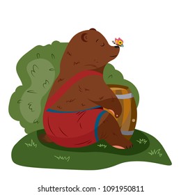 Bear on the lawn with a honey barrel