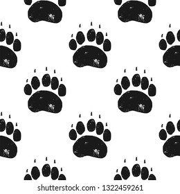 Bear paw pattern. Bear Claw seamless background. Footprint wallpaper. Vintage hand drawn silhoutte style. Stock Vector illustration isolated.