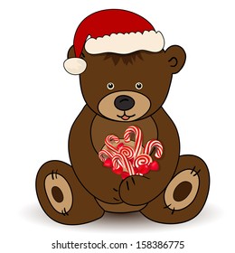 Bear in Santa Claus hat holding a candy