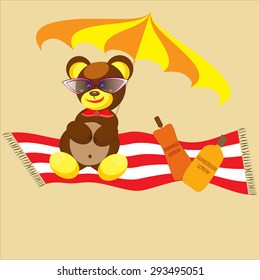 A bear sunbathing on the beach. Beach accessories.
