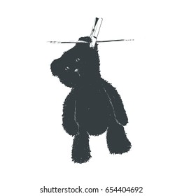 Bear teddy is dried on a rope, hooked with a clothespin