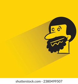 beard man with shadow on yellow background