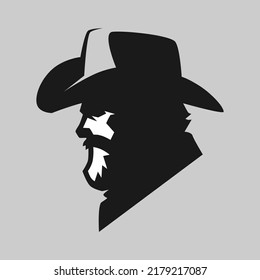 Bearded cowboy portrait side view symbol on gray backdrop. Design element