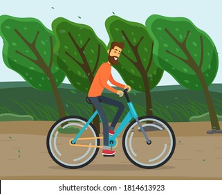 Bearded friendly man rides bicycle in park or out of town. Windy summer or spring weather. Trees slant from gusts of wind. Leaves are falling. Country road, countryside. Various weather conditions