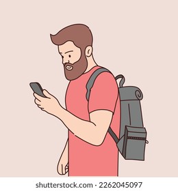 Bearded man with a backpack looks at the phone. Vector illustration.