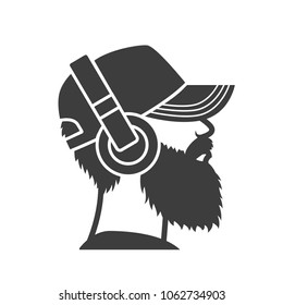 Bearded man in a cap and headphones