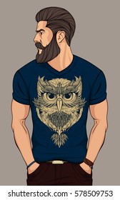 bearded man in dark blue  t shirt with gold owl