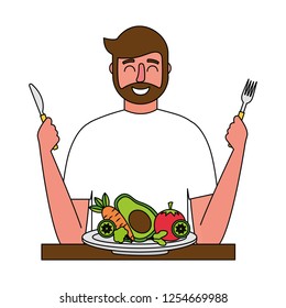 bearded man with fresh vegetable and fork knife