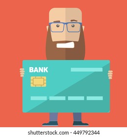 Bearded man holding a credit card and smile