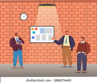 Bearded man holds clipboard, man in casual clothes stands with hands in pockets, bearded brown-haired male points to large stand with stickers. Brick wall, clock, ceiling lamp. Office workers