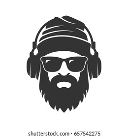 Bearded man in a knitted hat, sunglasses and headphones. DJ Hipster