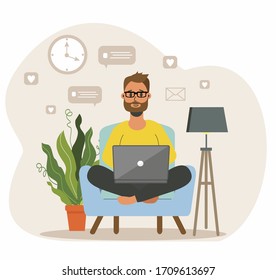 A bearded man sits on an armchair and works at a laptop. Remote work via the Internet. Home office concept, man working from home, student. Freelancer Vector illustration in cartoon style.