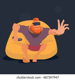 Bearded man sitting on an easy chair of yellow color on the head virtual reality device, remote in hand, stretches out his hand. VR technology. Virtual reality concept. 