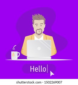 Bearded Man sitting at table with laptop