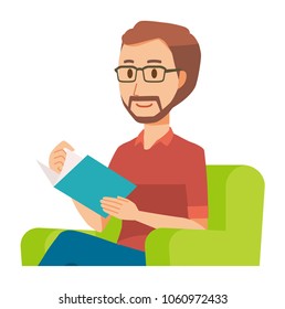 A bearded man wearing eyeglasses is reading on a sofa