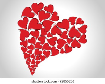 Beautiful Abstract heart shape made with small red color heart shapes on white isolated background for Valentines Day and other occasions.
