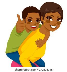 Beautiful african american brunette young mother with her son on piggyback ride smiling happy together