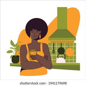 Beautiful african american woman plus size model stands in a clean kitchen with a glass of iced tea in her hand. Vector flat illustration in yellow and olive colors isolated on white background.