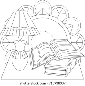 A beautiful antique lamp on the table. Two books and a simple round ornament in the background