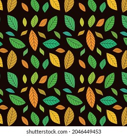 Beautiful Autumn leaves seamless pattern in orange, green, yellow on black background. Great for home décor, textile, wallpaper and Thanksgiving greeting cards.