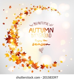 Beautiful autumn swirl of maple leaves. Place for text.