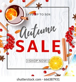 Beautiful background for autumn sale. Top view on composition with cup of mulled wine, rowan, cinnamon sticks on wooden texture. Vector illustration.