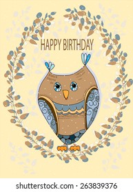 beautiful background card with a wreath of branches and owl with the words happy birthday