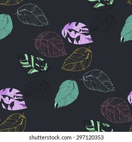 Beautiful background from different leaves on a gray background.Seamless.
