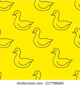 Beautiful background of toy ducks drawn with black marker on yellow paper. Seamless ducks pattern. Print for bed linen.