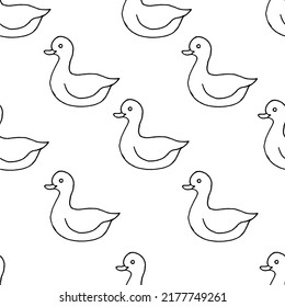 Beautiful background of toy ducks drawn with black marker on white paper. Seamless ducks pattern. Print for bed linen.