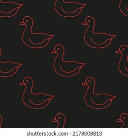 Beautiful background of toy ducks drawn with red marker on black paper. Neon seamless ducks pattern. Print for bed linen.