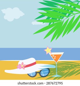 Beautiful beach weather, composition/still life of a white lady hat, retro sunglasses and a fancy, elegant cocktail drink in the shade of a palm tree at the seaside. Holidays.