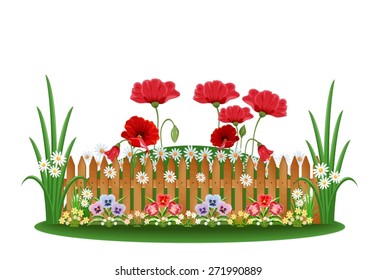 Beautiful bed with different flowers and a wooden fence