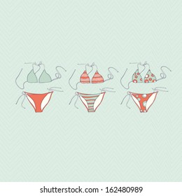 Beautiful bikini set on blue wave background. Perfect swimwear set. Perfect vacation or travel design element with women's clothes. Cute fully editable illustration drawn in vector by hand.
