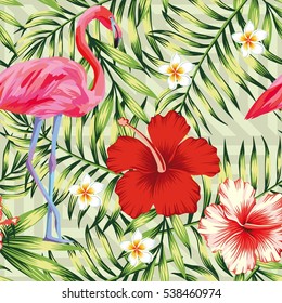 Beautiful bird pink flamingo, hibiscus and frangipani flower on a background of green palm leaves. Seamless vector hawaii print wallpaper pattern